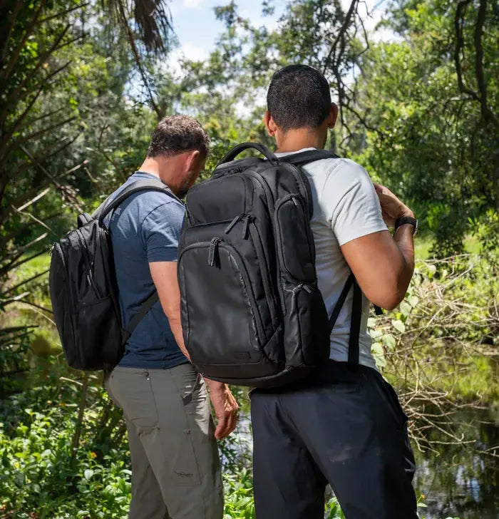 Two hikers carrying the EscapeZone Dual backpack