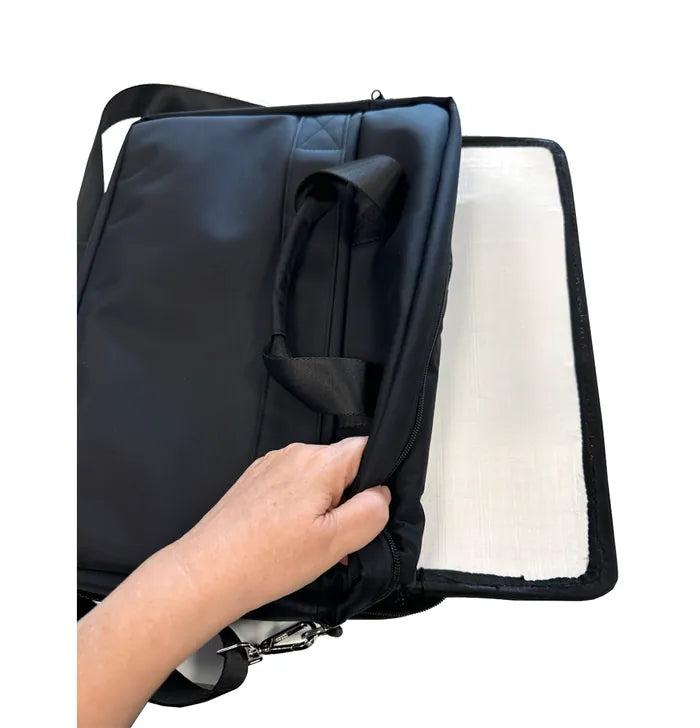 Kevlar ballistic insert sliding into the laptop bag
